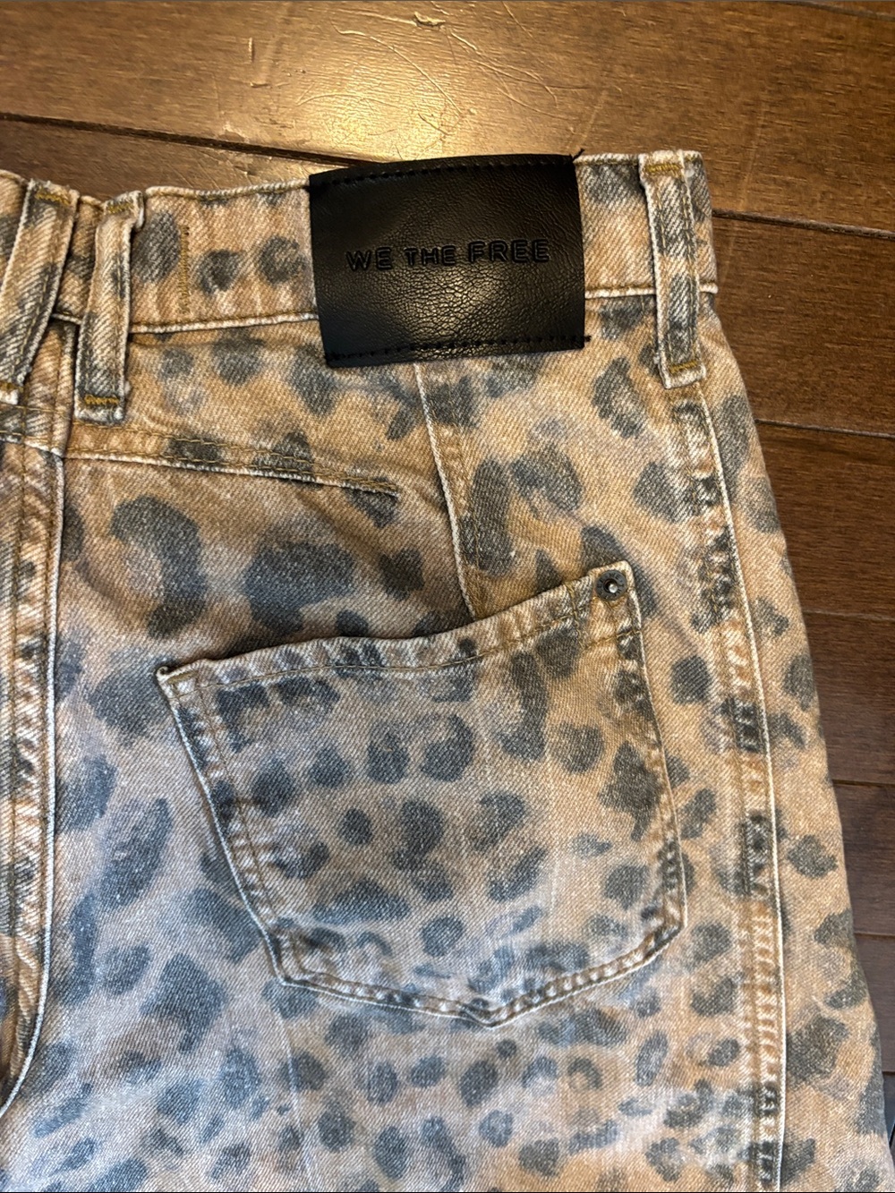 We The Free Leopard Print mid rise barrel Jeans in Light brown and faded black. - Picture 4 of 9